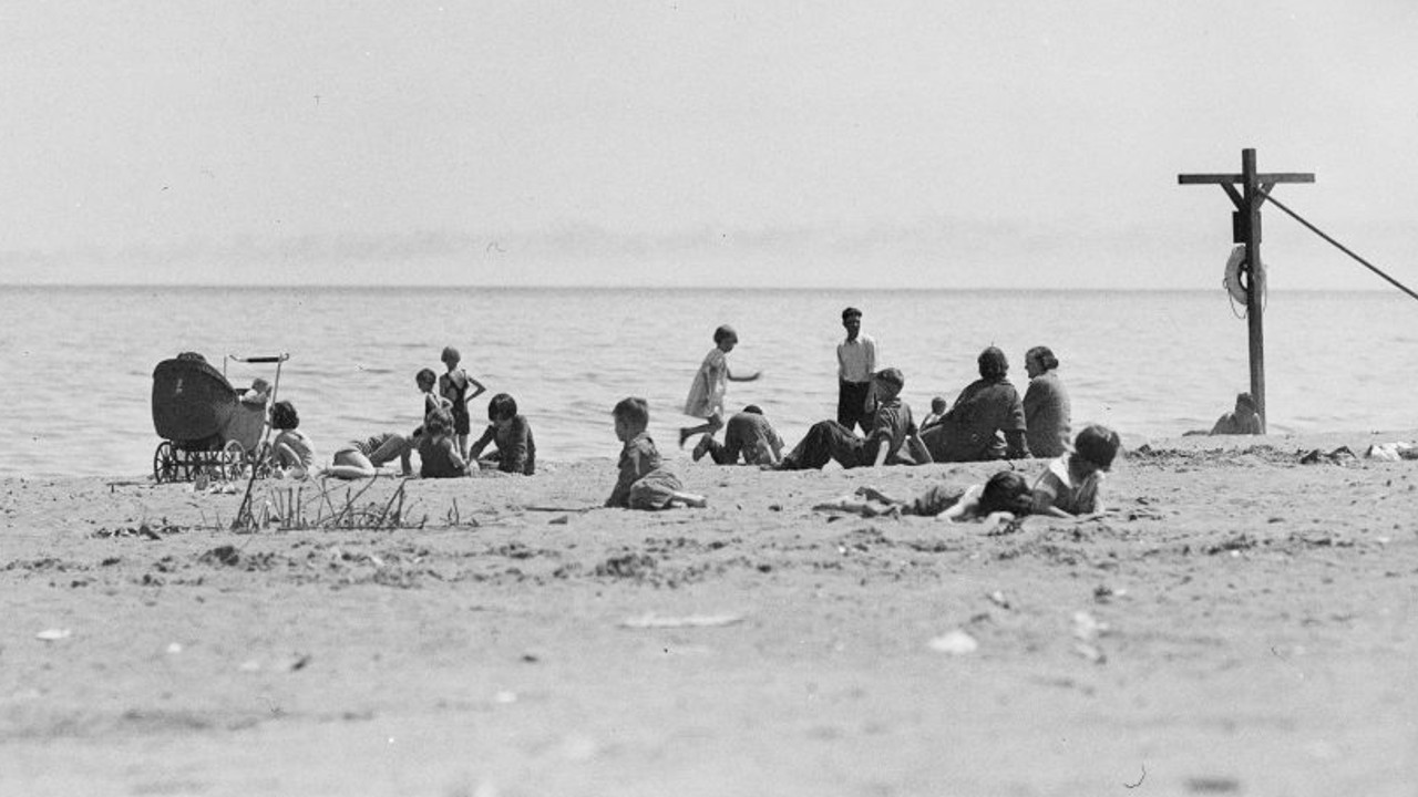 A black and white archival image of people on the beach in Toronto in 1936