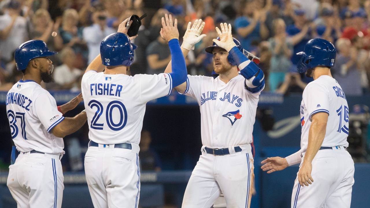 Toronto Blue Jay Brandon Drury celebrates a grand slam in August 2019