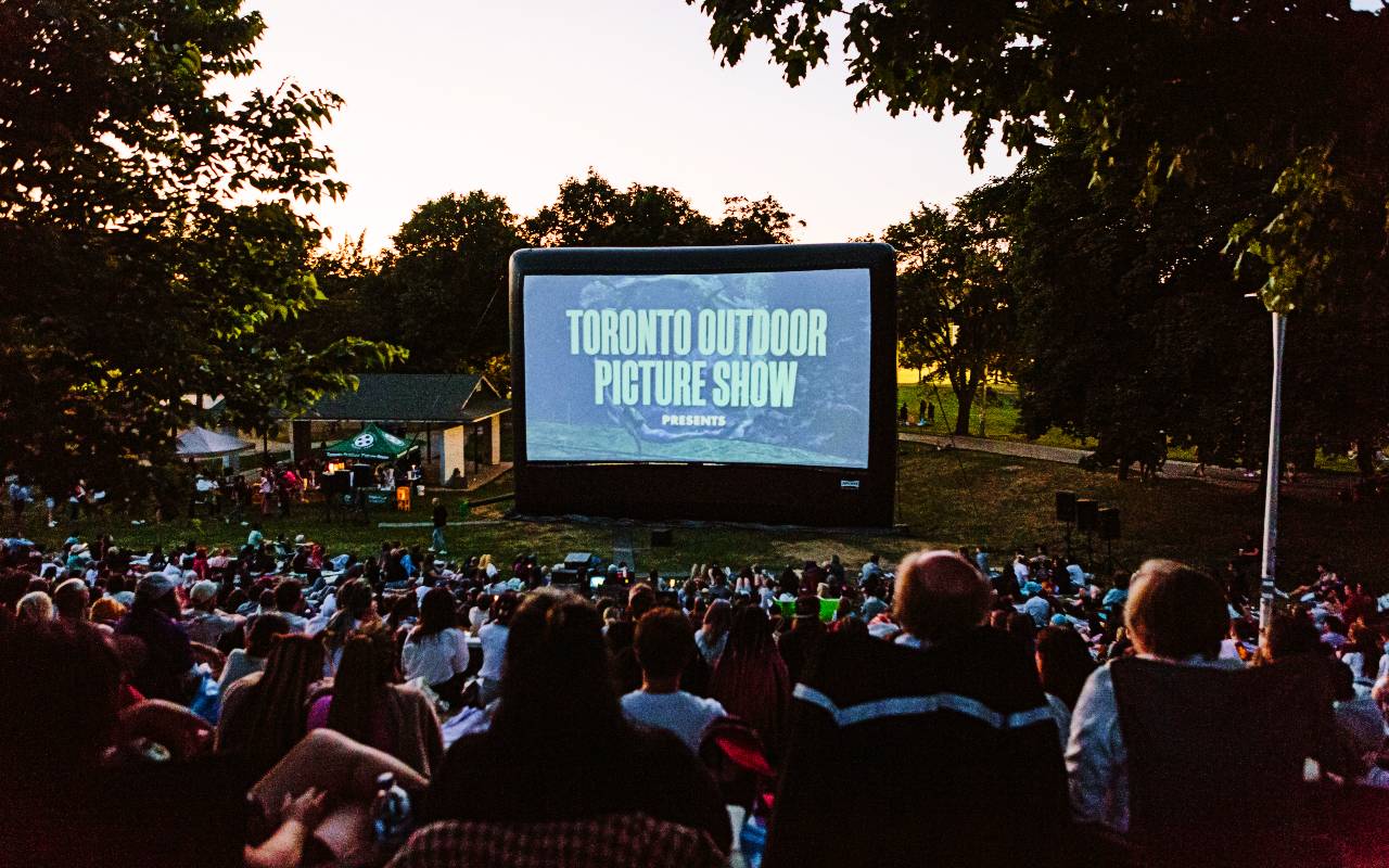 An image of a movie playing outdoors in Christie Pits Park in Toronto