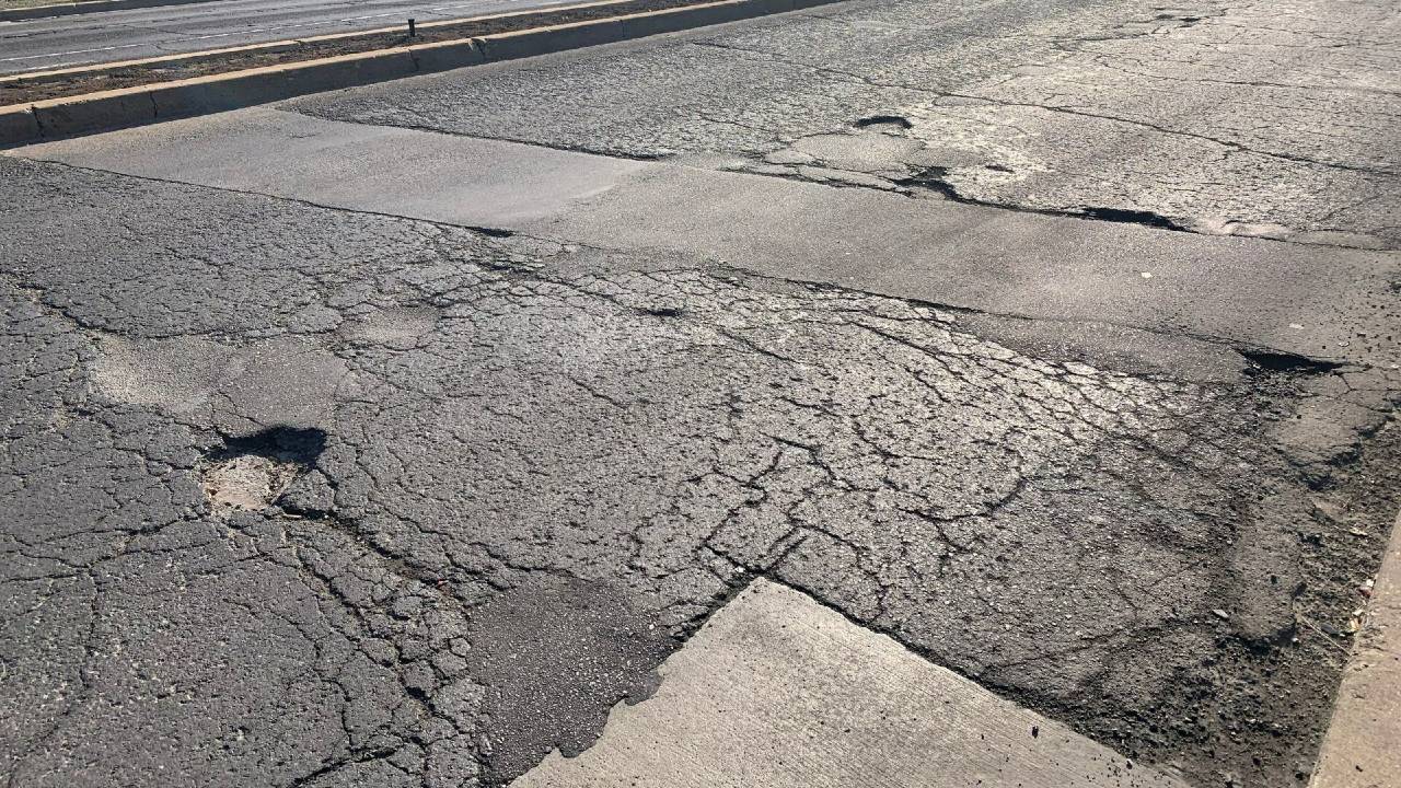 An image of alligator cracking on the asphalt of Barton St. E. in Hamilton