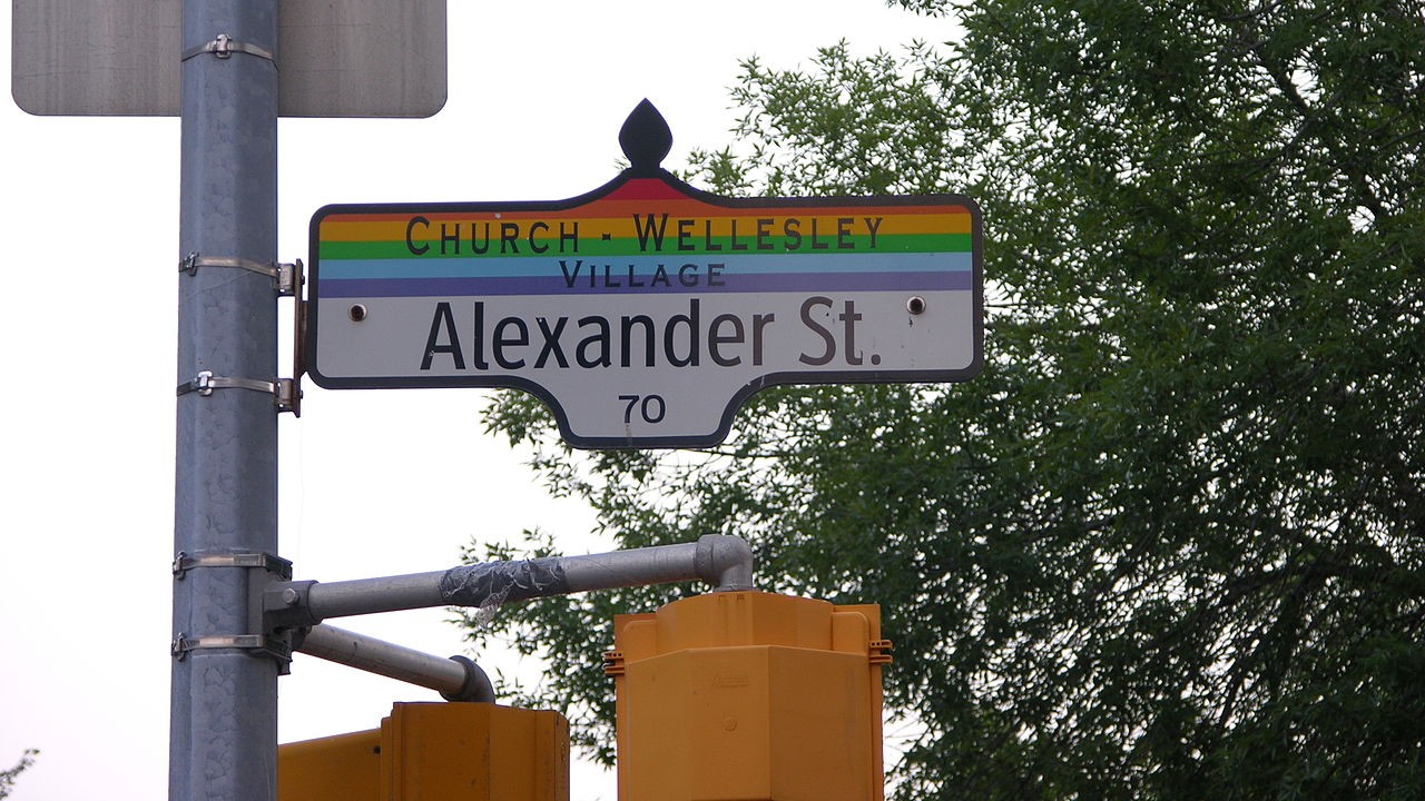 A photo of the Alexander St. street sign in Church and Wellesley Village, Toronto