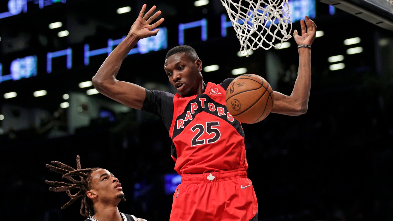 Toronto Raptors forward Chris Boucher dunks the ball in a December 2021 NBA game