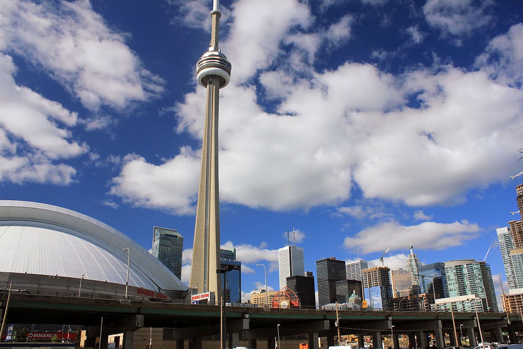 The CN Tower is seen towering over nearby buildings including the Rogers Centre