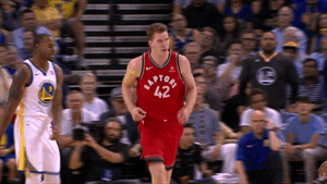 An animated image showing Jakob Poeltl celebrating as a member of the Raptors