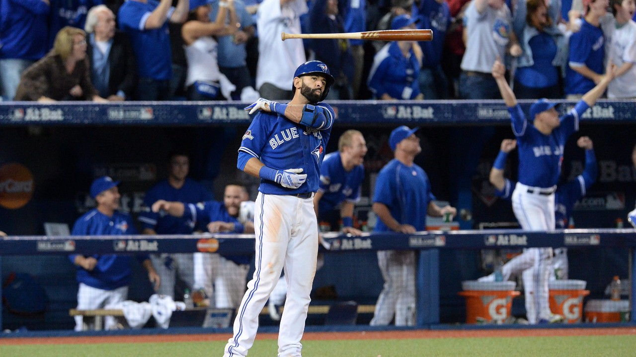 Toronto Blue Jays’ Jose Bautista flips his bat to the side after hitting a home run at Rogers Centre in the 2015 Major League Baseball playoffs