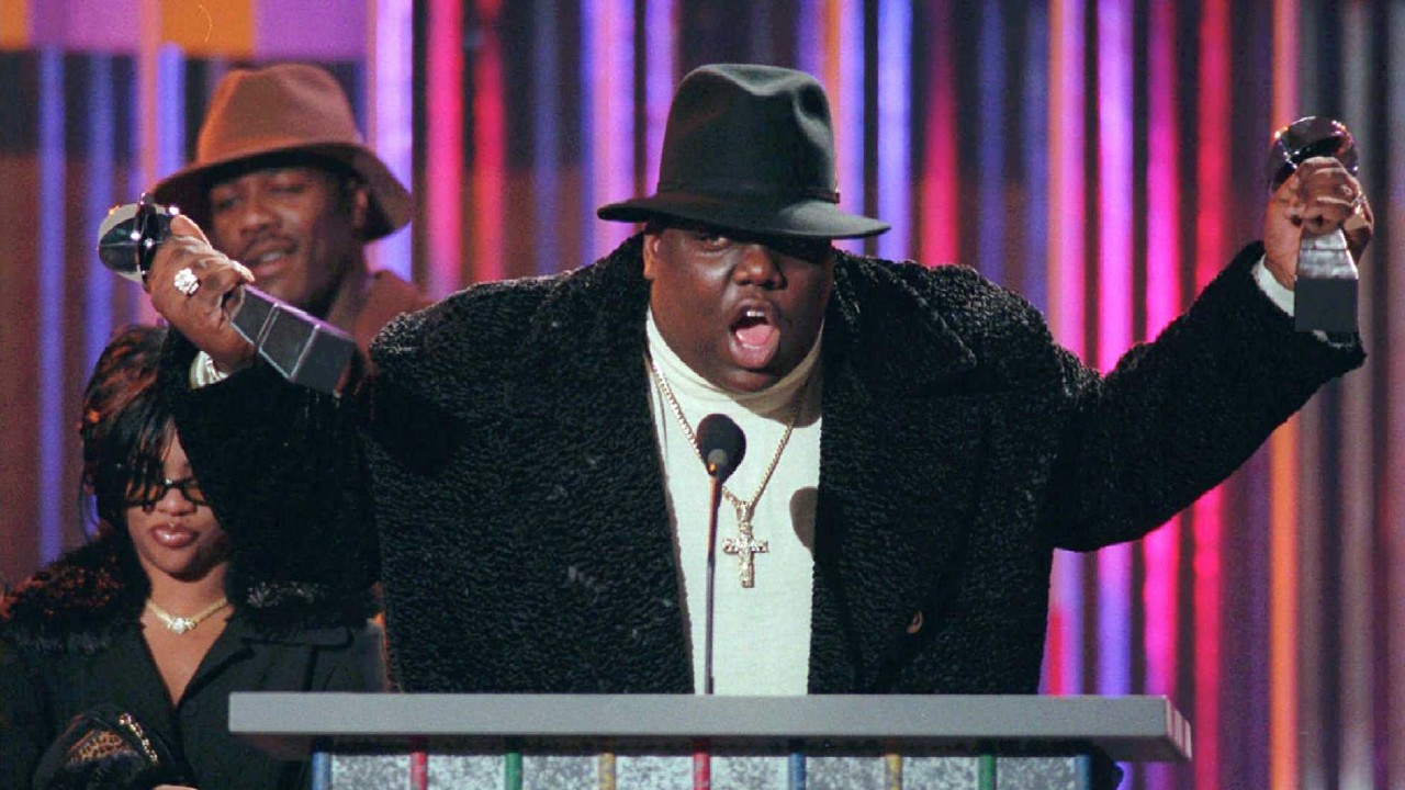 An image of rapper Notorious B.I.G. accepting awards