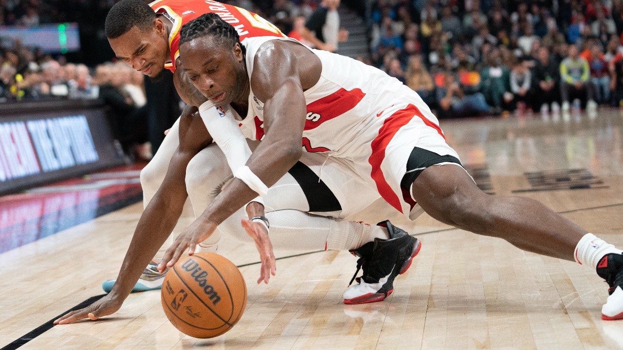 Toronto Raptors forward O.G. Anunoby fights for the ball against Atlanta Hawks guard Dejounte Murray