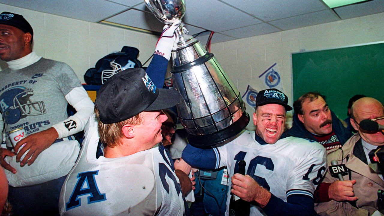 Argonauts players hoist the Grey Cup trophy after beating the Calgary Stampeders on Nov. 24, 1991