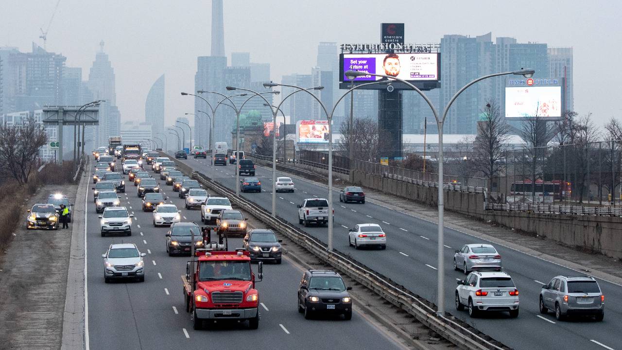 An image of traffic moving on a Toronto highway