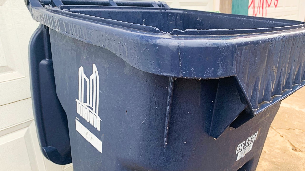 A closeup of a Toronto blue box recycling bin