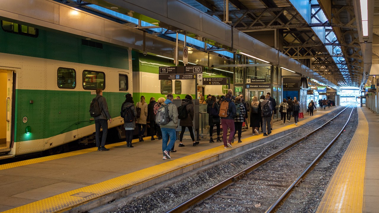 An image of a GO train leaving the Union Station train shed in Toronto